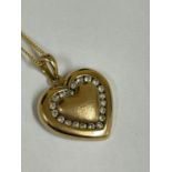 Vintage 9ct gold and diamond pendant on yellow metal chain. 4g