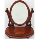 AN OVAL SHAPED FREE STANDING DRESSING TABLE MIRROR WITH HINGED MAKEUP COMPARTMENT. 64 X54cms A/F