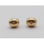 A Pair of 14k Yellow Gold Diamond Button Stud Earrings. 1.44g