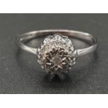 9K White Gold Diamond cluster ring. Weighs 1.5g and is a size N.