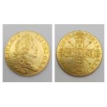A GOLD PLATED REPRODUCTION OF A 1701 WILLIAM III FIVE GUINEA COIN.