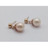 Pair of 14K Yellow Gold and Natural Pearl Drop Earrings. 1.83g