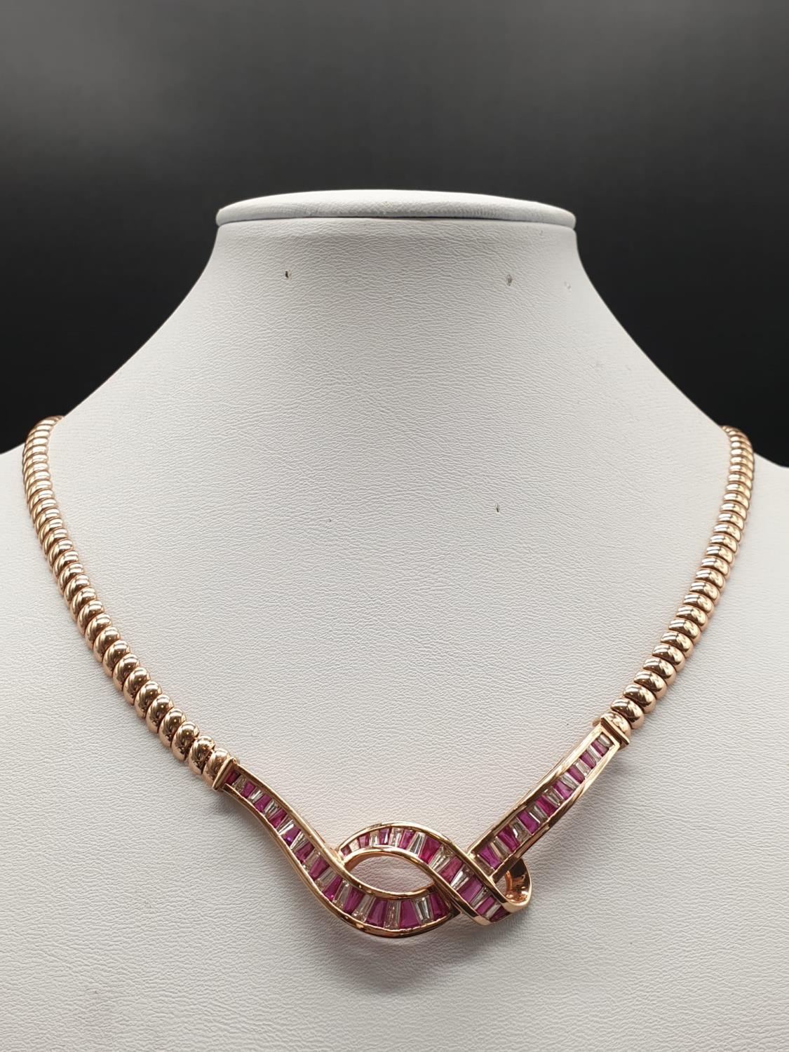 AN ITALIAN DESIGNED 18K ROSE GOLD NECKLACE WITH 3 CT OF DIAMONDS AND 3CT OF PINK RUBY IN A FORGET ME