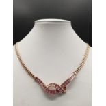 AN ITALIAN DESIGNED 18K ROSE GOLD NECKLACE WITH 3 CT OF DIAMONDS AND 3CT OF PINK RUBY IN A FORGET ME