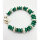185cts of Emerald and Pearl Bracelet with Pearl Clasp in 925 Silver. 7cm diameter.