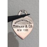 An original Tiffany silver heart pendant with box and dust bag; 5.1g;