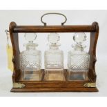 Vintage (circa 1930) Tantalus Decanter Three-Bottle set. Comes with original working key . Very good