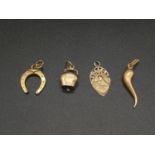 9K Yellow Gold set of 4 charms. Total weight 3.9g.