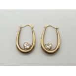 A Pair of 9K Yellow Gold and White Stone Horse Shoe Earrings. 1.14g