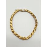 A Beautiful 18K Yellow Gold Italian signed Retti Ball link bracelet. Three rows of linking geometric
