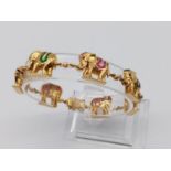 A Stunning 18K yellow gold diamond and precious gem elephant bracelet. Hand-crafted with 20 diamonds