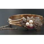 An 18K yellow gold bracelet with diamonds, rubies and pearls. Total weight 27.8g.