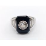 Platinum diamond & onyx ring. Brilliant cut 0.8 carat diamond (appr.) Ring Size: Q. Weight: 8.1g
