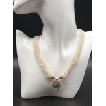 FRESHWATER PEARL NECKLACE WITH 18K YELLOW GOLD TOPAZ & DIAMOND CLASP.