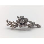 A vintage floral diamond brooch. Weight 7.3g. Length: 4.8cm. In excellent condition.