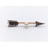 A vintage rose gold diamond and pearl brooch in the form of an arrow. Weight:3.7g. Length: 5.1cm.