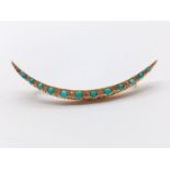 A yellow gold diamond and turquoise hair clip. Weight: 8.8g. Length: 7cm. Very good condition with