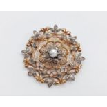 A vintage yellow gold brooch with diamonds. Total weight 18.3g. Diameter 4.5cm. No damages or
