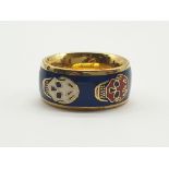 An early, original, Alexander McQueen, gold plated ring with white and red skulls on royal blue
