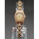 A 9k Yellow Gold Vintage Renown ladies Watch. Gold hallmarked strap and case. Dial shows signs of