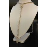 White metal stone set rosary bead necklace with cross. Weighs 88.9g.
