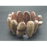 Wooden Bead Expandable Bracelet covered in Marine-Like Shells.