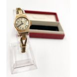 A Vintage James Walker of London Ladies Wristwatch. 9K Yellow Gold case. Rolled Gold strap. In
