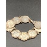 Vintage silver three pence bracelet having nine silver coins in double link formation. 17 cm approx.
