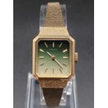 A Vintage Ladies Seiko 11 Watch. Gold Plated Strap. Green Dial. In working order.