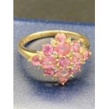 A 9 carat gold PINK TOPAZ cluster ring. 2.7 grams . Size M 1/2.