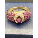 9 carat gold cocktail cluster ring set with DEEP PINK TOURMALINE AND DIAMONDS to top. 3.3 grams .