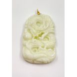 A CARVED ELEPHANT PENDANT IN WHITE JADE 16.4gms