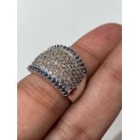 10k white gold diamond eternity ring set with approx 1.75ct of blue, white and brown diamonds,