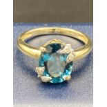 Ladies 9 carat GOLD RING ,having faceted large BLUE AQUA stone in basket mount , set with gold and