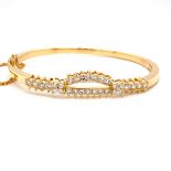18k yellow gold diamond bangle with safety chain, approx 1.34ct round brilliant diamonds, weight 26g
