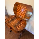 A VICTORIAN GAMING/ NEEDLEWORK TABLE , MADE IN WALNUT WITH INLAID OPENING TOP AND DRAWER. 63 X 41cms