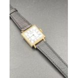 Vintage ladies Sekonda wristwatch, having square white face with black numerals in gold tone case.