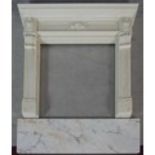 A faux polished marble fire surround in the Classical style with floral decorated frieze and
