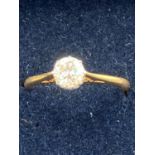 An 18 carat GOLD and DIAMOND SOLITAIRE ring having a full 1/3 carat diamond set in a platinum