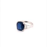 18K WHITE GOLD SAPPHIRE AND DIAMOND RING. 3.40CT THAI BLUE SAPPHIRE CUSION CUT CENTRE WITH