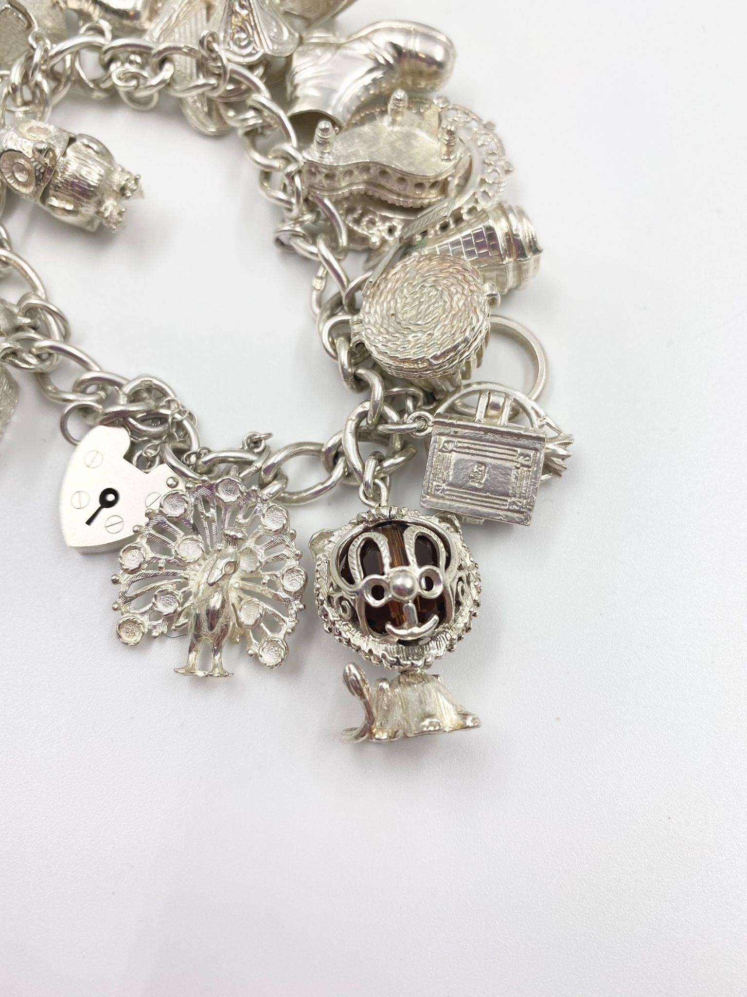 STERLING SILVER CHARM BRACELET WITH 20 CHARMS. 84.2G - Image 2 of 6