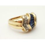 14K yellow gold diamond and sapphire ring. 5.2g. Size N.