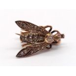 A small but beautifully made brooch in the form of a fly with diamonds rubies for eyes. Weight 4.6g.