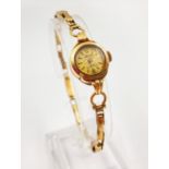 A Vintage Ladies Accurist Gold Watch. 9K Yellow Gold strap and case. Gold-tone dial. 13mm case