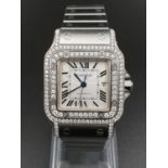A CARTIER STAINLESS STEEL TANK STYLE WATCH WITH DIAMOND BEZEL AND SURROUND, AUTOMATIC 28MM