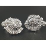 A stunning Art Deco platinum (stamped Pt 950) and diamonds pair of earrings. Total diamond weight: