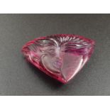 A beautifully carved pink tourmaline with WGI certificate. Weight: 103.22 ct. Dimensions: 44 x 35