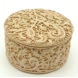 A Vintage Ornate Resin Trinket box. 6cm diameter.