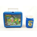 A Retro Teenage Mutant Hero Turtles Lunchbox and Flask.