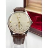 A Vintage (1950s) Longines Gents Wristwatch. Champagne Dial with stainless steel case. Manuel